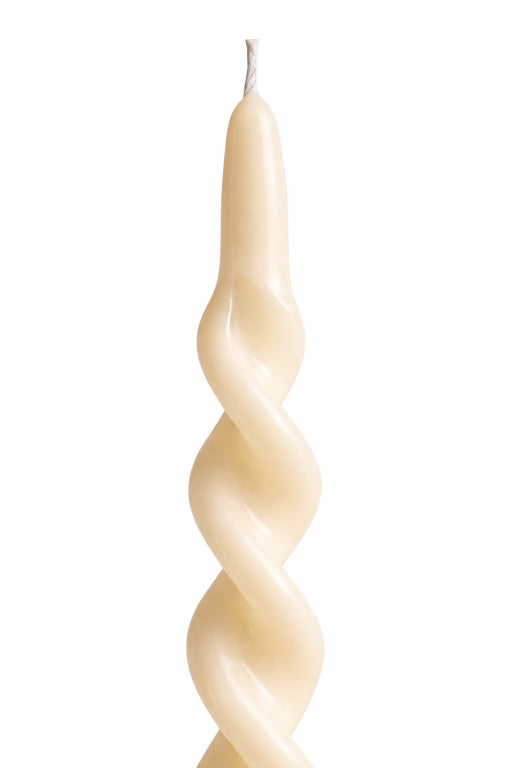 Close-up of ivory spiral taper candle with twisted sculptural design by flame elegance, handcrafted soy wax unscented candle ideal for modern decor, weddings, and table settings. 