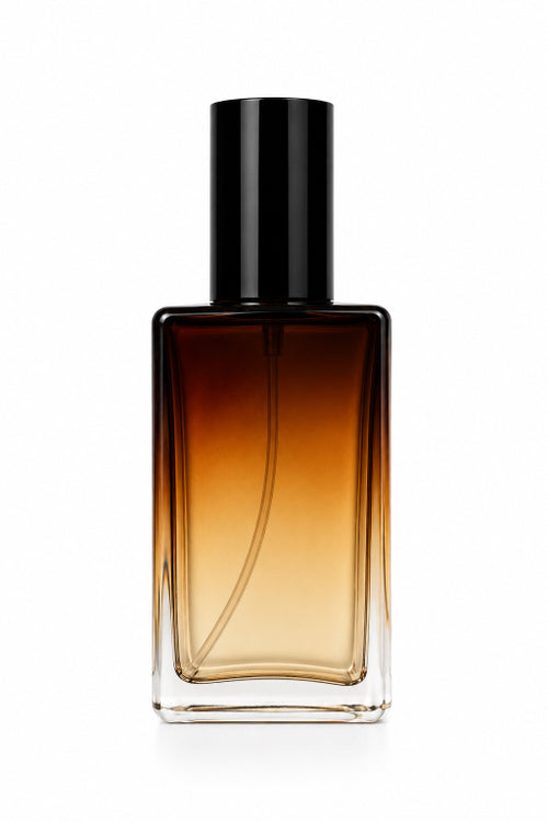 A rectangular glass perfume bottle with a black cylindrical cap, featuring a warm amber-to-clear gradient liquid, set against a plain white background. Amber Noir fine perfume spray by Flame Elegance.