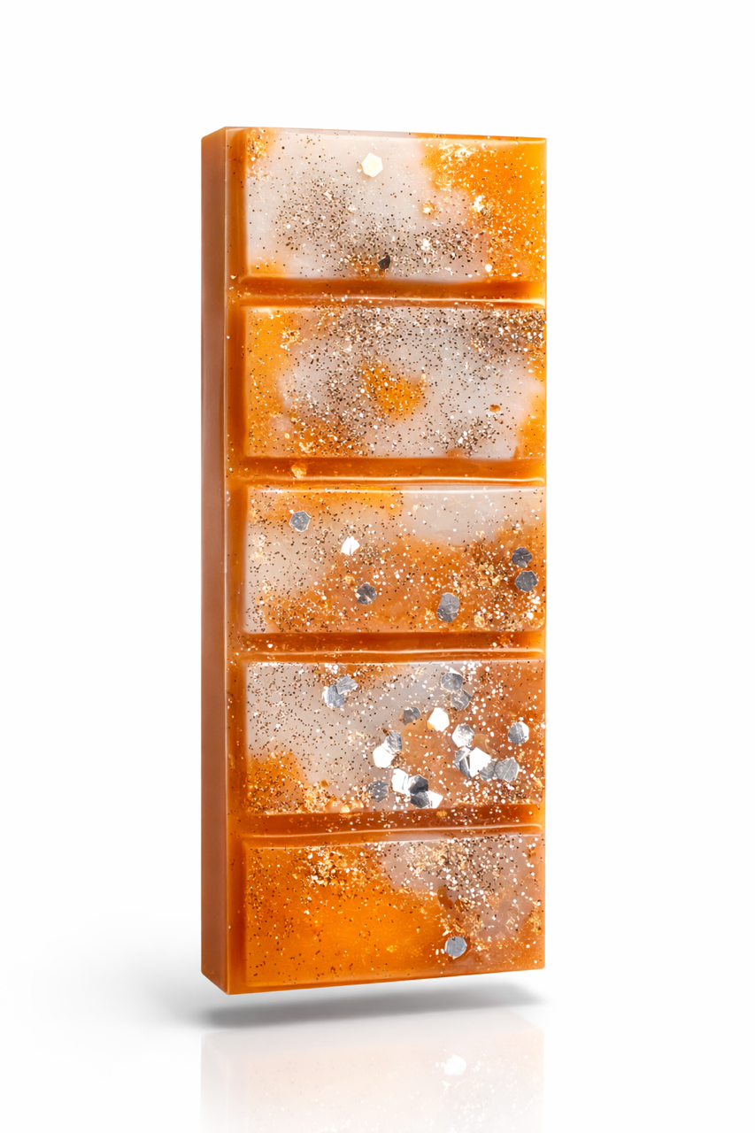 Close up of amber noir wax melt bar showing rich color and smooth wax texture adorned with mica shimmer and glitter for extra shine
