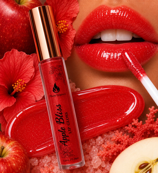 A tube of Phatomakeup 'Apple Bliss' glitter lip gloss is displayed alongside a model's lips wearing the glossy red gloss, with red apples and hibiscus flowers in the background.