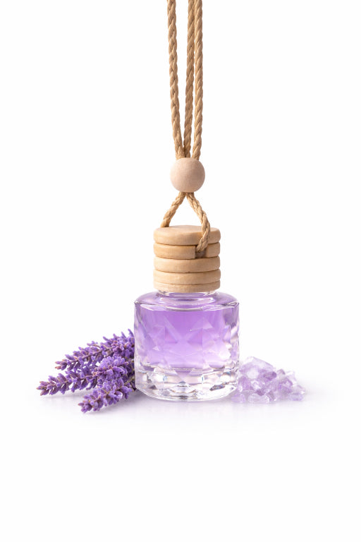 Purple car aroma diffuser with wooden holder and lavender flowers on a white background made by flame elegance 