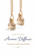 Two leatherwood dusk aroma diffusers y Flame Elegance with with strings to hang them from  on a white background, labeled 'Flame Elegance'.