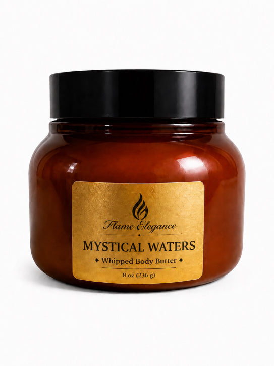 Jar of 'Mystical Waters' whipped body butter with a gold label on a white background by Flame Elegance