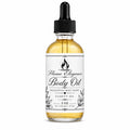 Bottle of Flame Elegance Eucalyptus Body Oil with black lid and dropper. White background. 