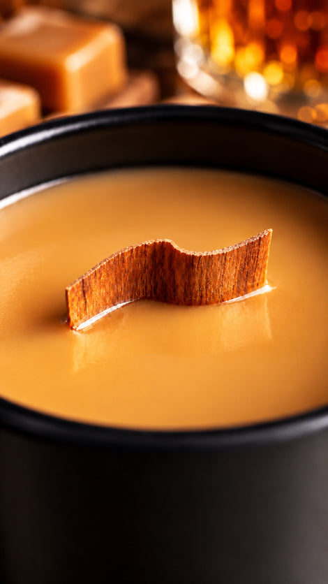 up close image of butter rum soy wood wick candle by flame elegance