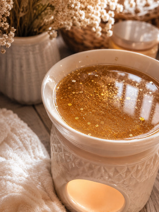 wax melter with shimmering caramel orchard wax melts melted in warmer by Flame Elegance