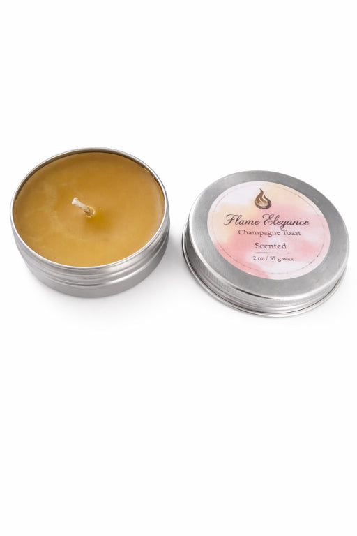 champagne toast scented mini 2 oz candle in a tin jar by flame elegance with white background