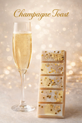 champagne toast ax melt bar with gold accents beside a glass of sparkling champagne on an elegant background