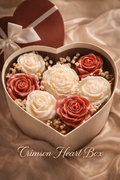 Heart-shaped box filled with red and white roses on a satin background
