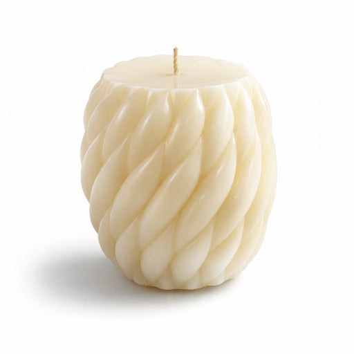 Flame Elegance champagne scented pillar candle close up to show sculpted design with white background. Eco-friendly soy wax and luxury home interior.