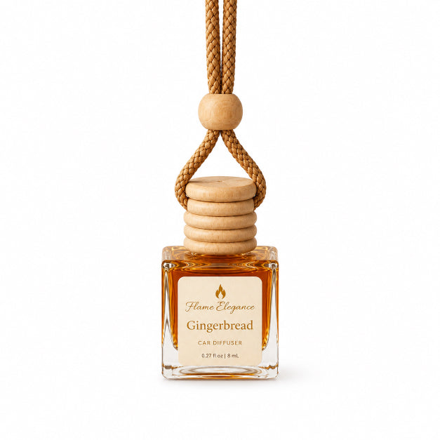 A Flame Elegance Gingerbread car diffuser featuring a clear glass bottle filled with amber liquid, a light wood beaded cap, and a braided tan cord, shown on a white background.