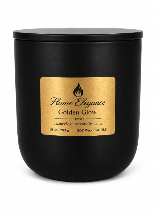 A matte black soy wax candle jar with a square gold label reading 'Flame Elegance Golden Glow' on a white background by Flame Elegance