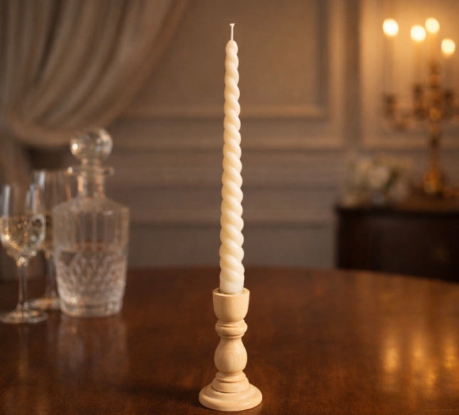 Eco friendly ivory taper candle luxury home decor clean burning spiral candles. candle sitting on a dining room table. 