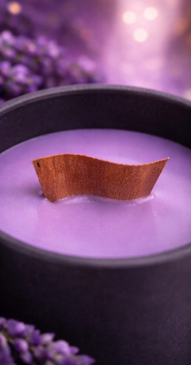 Lavender moon aromatherapy candle with calming lavender scent, clean burn soy wax, wood wick, black ceramic vessel with purple shimmer. 
