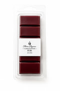 Clamshell packaging of Burgandy Leatherwood wax melt bar in a clear plastic packaging with 'Flame Elegance' branding on a white background.