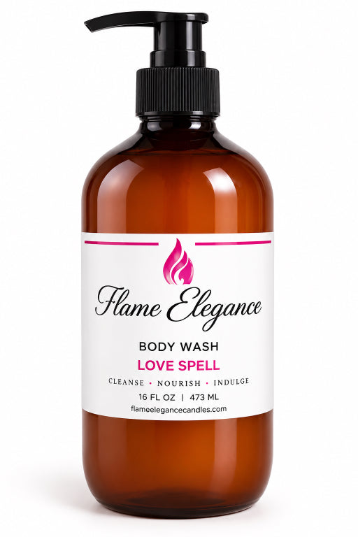 An amber plastic pump bottle of Flame Elegance Love Spell Body Wash on a clean white background.