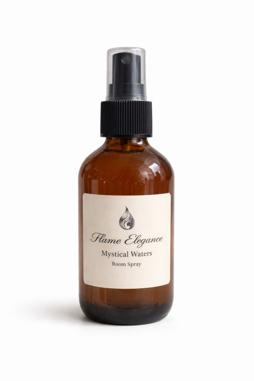 Brown spray bottle labeled 'Flame Elegance Mystical Waters Room Spray' on a white background