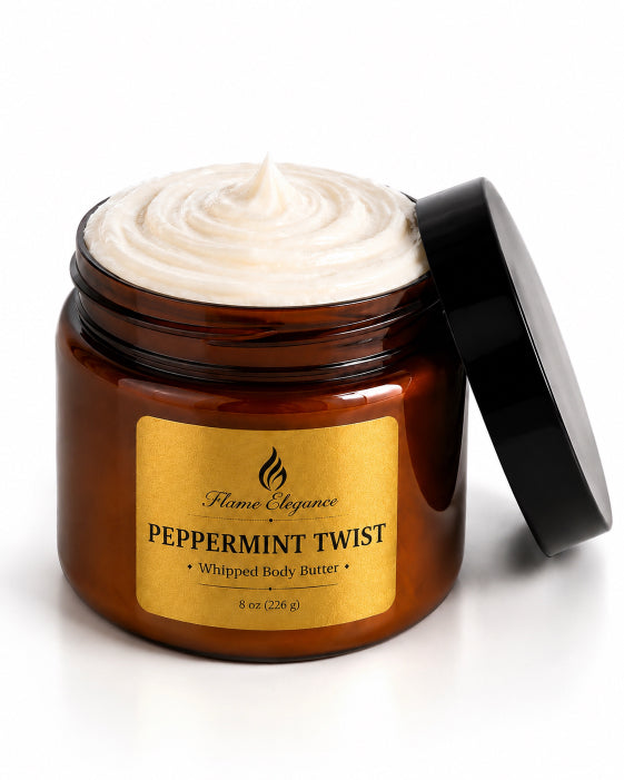 An open jar of Flume Elegance Peppermint Twist Whipped Body Butter, showing the whipped cream product inside an amber glass jar with a black lid leaning against it on a white background.