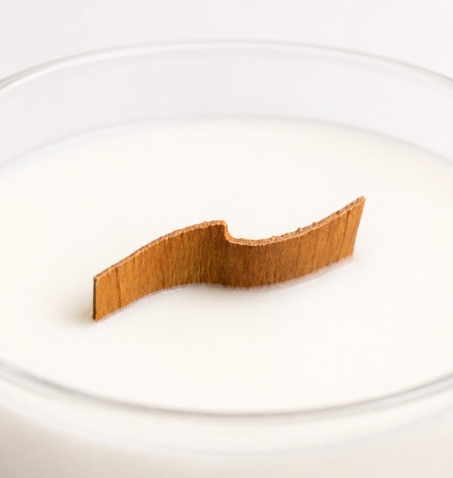 Peppermint twist wood wick candle up close shot of curved wood wick and white wax in a clear vessel by Flame Elegance. 