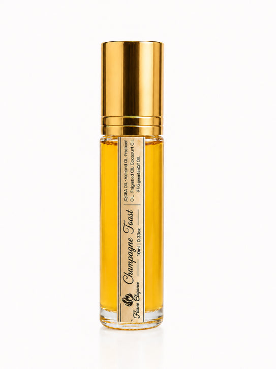 Gold and clear bottle of 'Champagne Toast scent luxury perfume oil on a white background by Flame Elegance