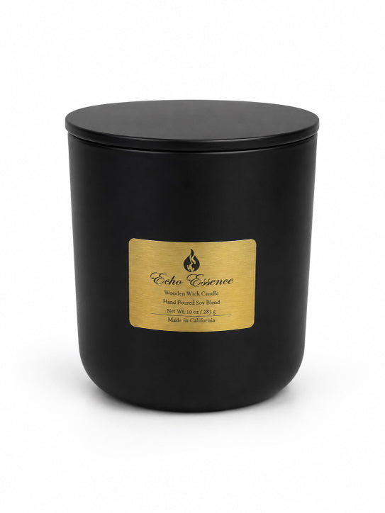 pumpkin spice candle in a black glass vessel with a thin lid on top gold label by Flame Elegance and a white background