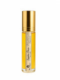 Elegant Gold and clear bottle of sapphire desire perfume with a white label on a white background by Flame Elegance