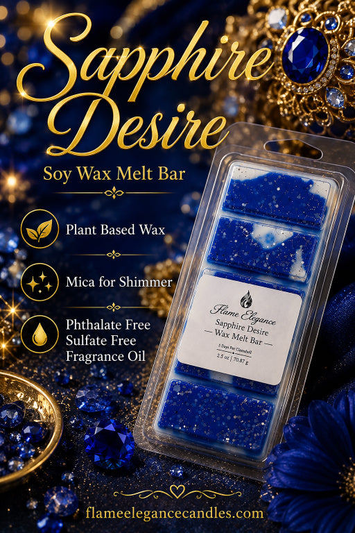 Sapphires Desire soy wax melt bar by Flame Elegance Candles, packaged in a clear plastic clamshell with four blue wax compartments and a white label. The product is displayed on a dark, glittery background decorated with blue gemstones, gold jewelry, and gold text detailing its features.