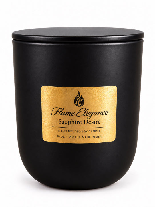 A matte black jar candle with a matching black lid and a prominent gold label reading 'Flame Elegance Sapphire Desire'.