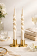 Ivory spiral taper candles made from natural soy wax, unscented elegant twisted design. Approximately 10 inches tall for minimalist home decor and dinner table styling