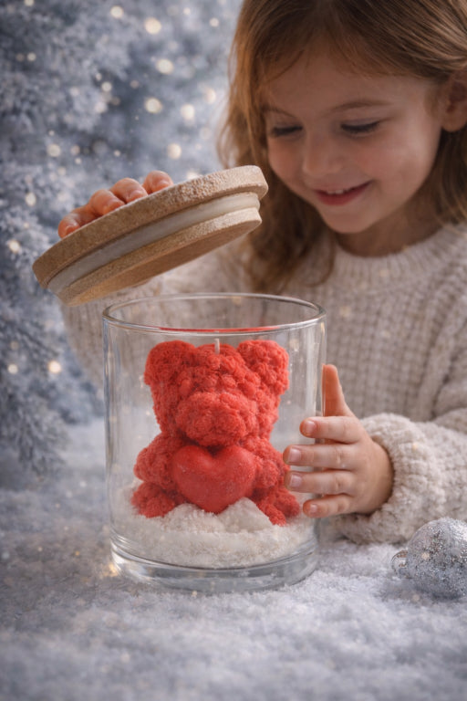 child opening frosted teddy embrace scented with sugar plum by flame elegance