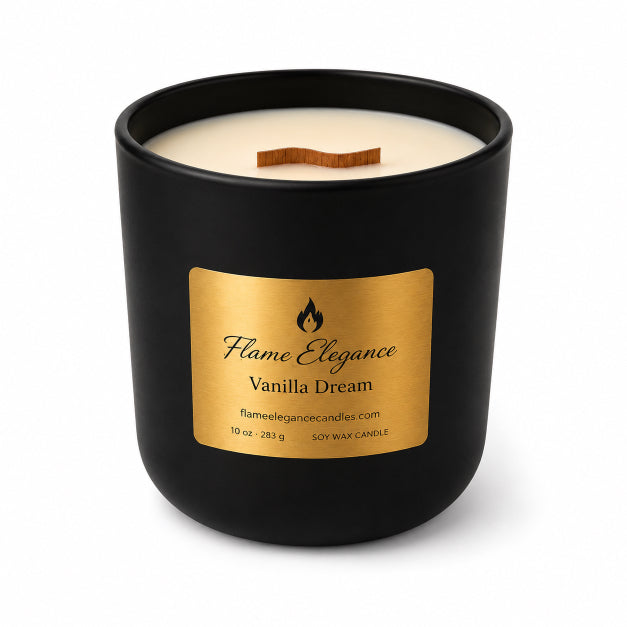 A black soy wax candle in a matte black jar with a gold label reading 'Flame Elegance Vanilla Dream' and a wooden wick, shown on a white background.